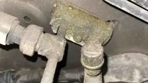 A technician at Nogueira Automotive Mechanic, LLC performing repairs on a vehicle's air conditioning system to ensure optimal performance and comfort.