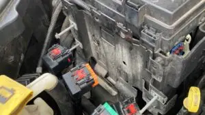 A technician at Nogueira Automotive Mechanic, LLC performing regular maintenance on a vehicle's electronic systems to ensure optimal performance and longevity.