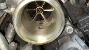 A technician at Nogueira Automotive Mechanic, LLC performing repairs and maintenance on a heavy duty vehicle, such as a truck or bus, to ensure optimal performance and reliability.