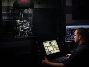 A technician at Nogueira Automotive Mechanic, LLC performing repairs and maintenance on a vehicle's electrical system to ensure optimal performance and reliability.